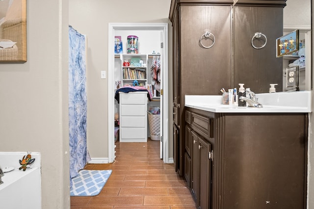 bathroom with wood-type flooring and vanity