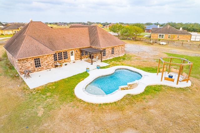 view of swimming pool featuring a patio