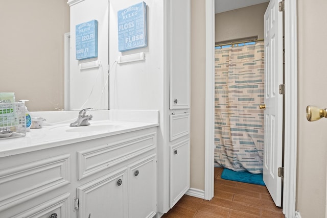 bathroom with vanity, hardwood / wood-style flooring, and a shower with shower curtain