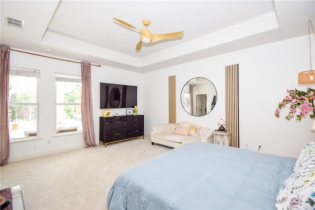 15854 El Soccorro, Corpus Christi, TX 78418 - bedroom with a tray ceiling, light carpet, crown molding, and ceiling fan