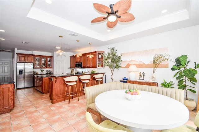 15854 El Soccorro, Corpus Christi, TX 78418 - dining space with a tray ceiling, light tile patterned floors, a ceiling fan, and recessed lighting