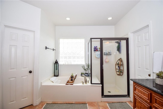 15854 El Soccorro, Corpus Christi, TX 78418 - bathroom with a shower stall, a bath, tile patterned flooring, and vanity
