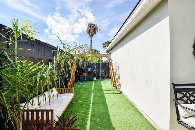 15854 El Soccorro, Corpus Christi, TX 78418 - fenced backyard with a playground