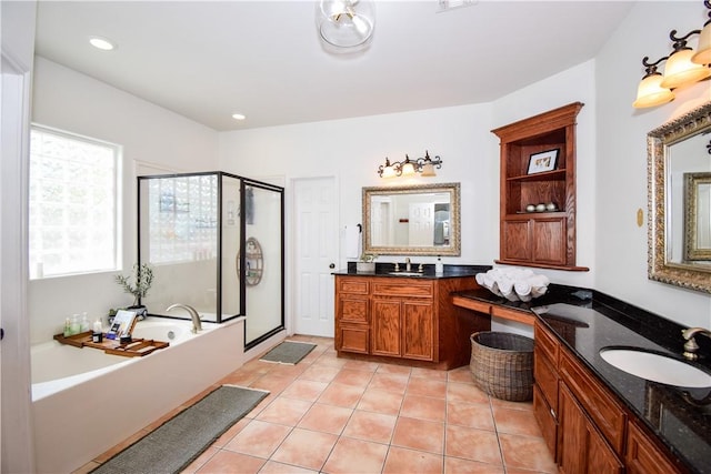 15854 El Soccorro, Corpus Christi, TX 78418 - bathroom featuring a stall shower, a bath, tile patterned floors, two vanities, and recessed lighting