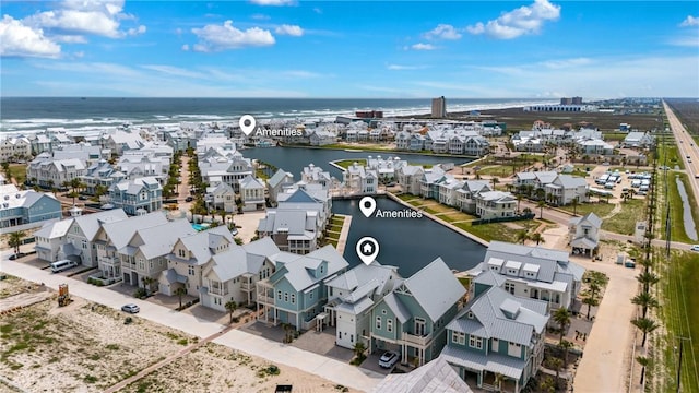 bird's eye view with a water view and a residential view