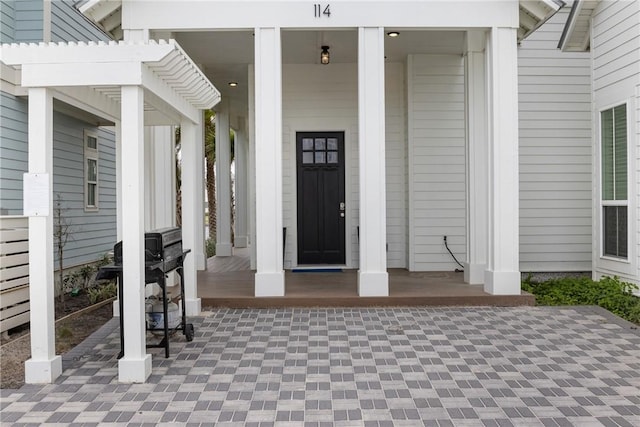 doorway to property with a porch