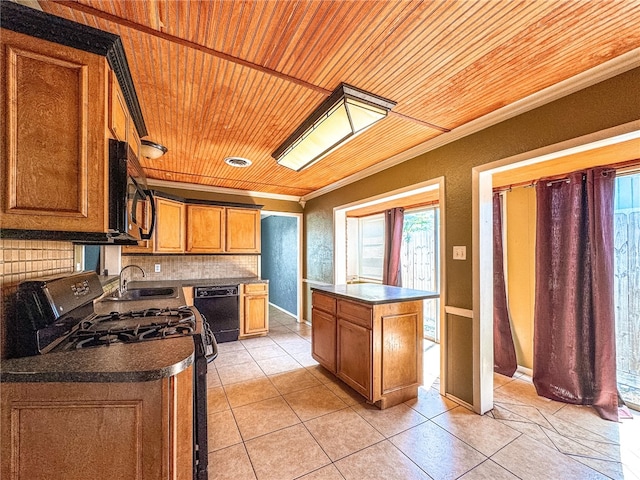 kitchen with sink, wooden ceiling, ornamental molding, a kitchen island, and appliances with stainless steel finishes