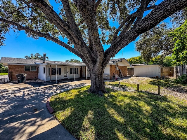 ranch-style home with a front lawn