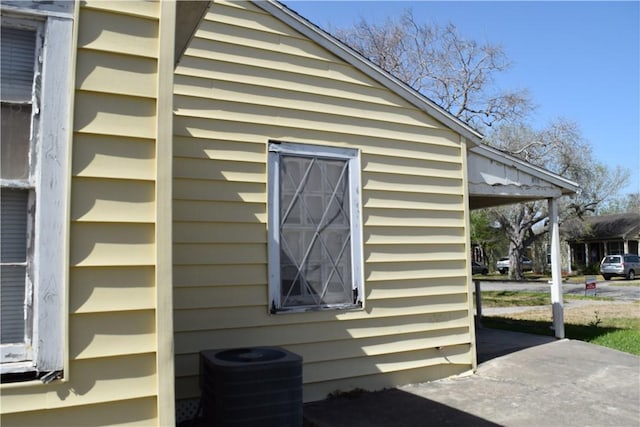 view of property exterior with central AC unit