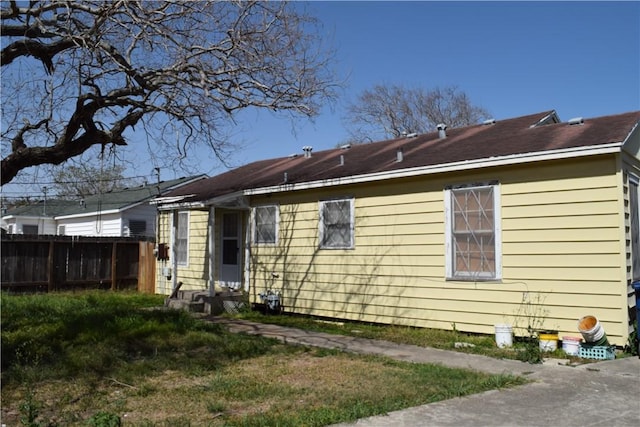 back of property with fence