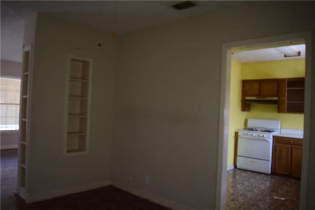 empty room with visible vents and baseboards