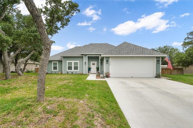 view of front facade featuring a front yard and a garage