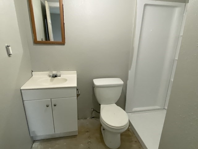 bathroom with toilet and vanity