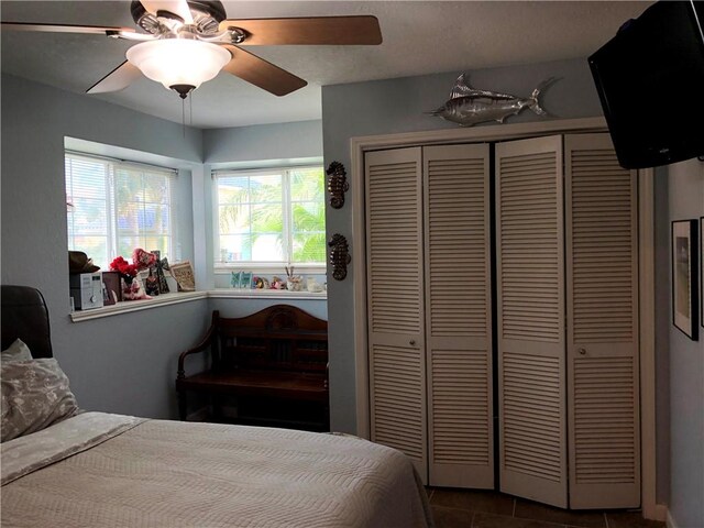 13938 Dasmarinas Dr, Corpus Christi, TX 78418 - bedroom with a closet, a ceiling fan, and tile patterned floors