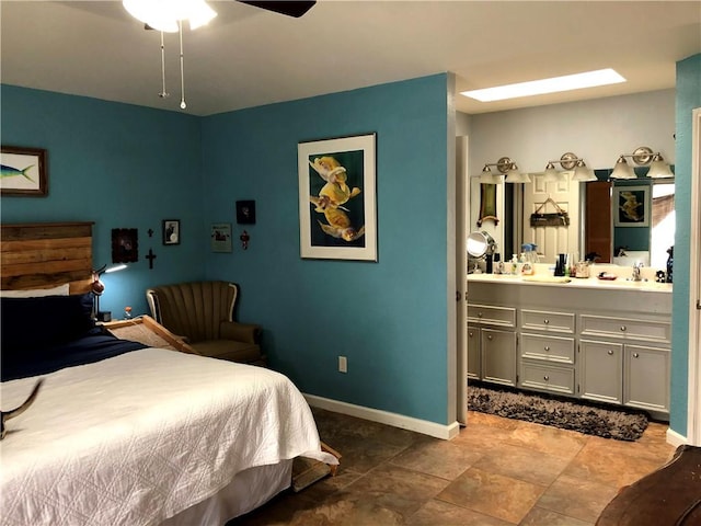 13938 Dasmarinas Dr, Corpus Christi, TX 78418 - bedroom featuring ensuite bathroom, stone finish flooring, and ceiling fan