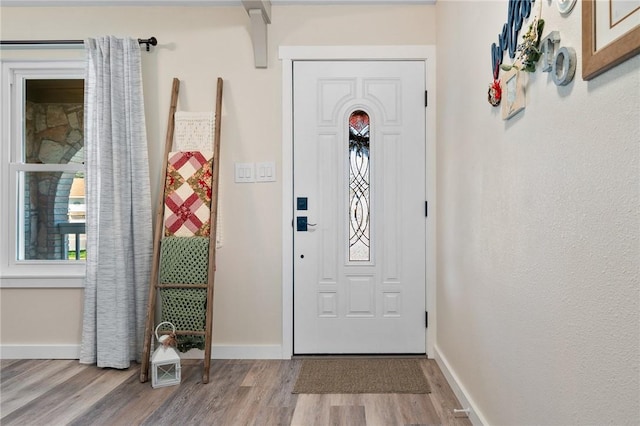 entryway with light hardwood / wood-style flooring