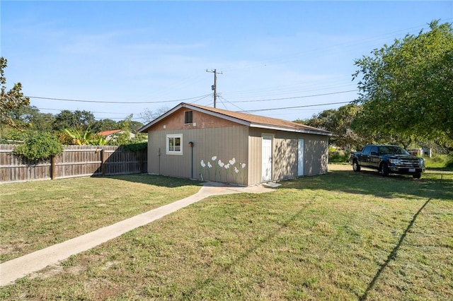 view of outdoor structure with a lawn