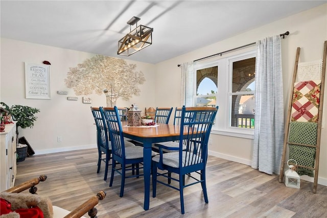 dining space featuring hardwood / wood-style floors