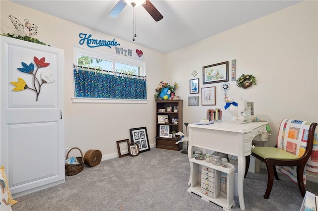 home office featuring light colored carpet and ceiling fan