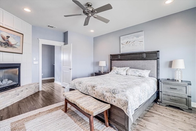 bedroom with light hardwood / wood-style floors and ceiling fan