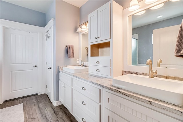 bathroom featuring hardwood / wood-style floors and vanity