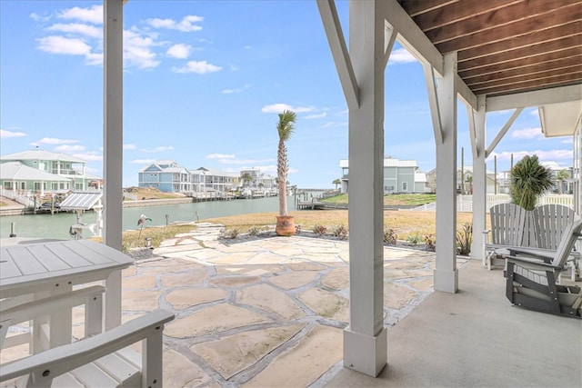 view of patio with a water view