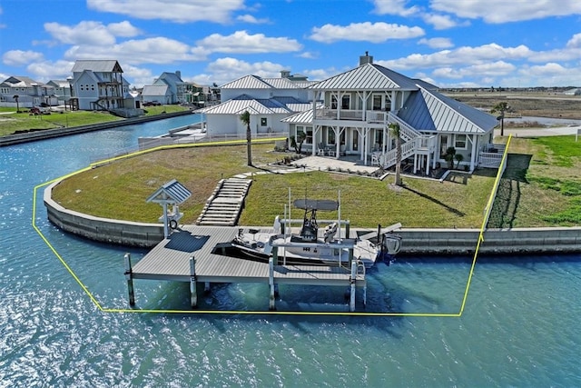 dock area with a yard, a water view, and a patio area