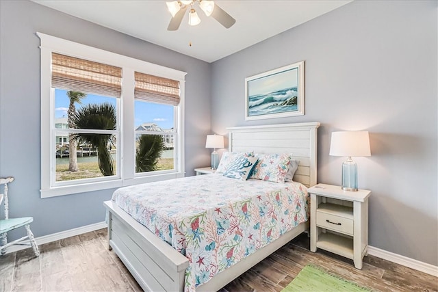 bedroom with hardwood / wood-style flooring and ceiling fan