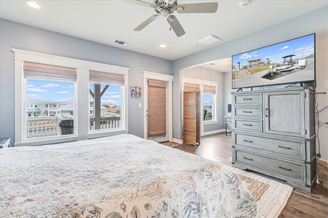 bedroom with ceiling fan and dark hardwood / wood-style floors