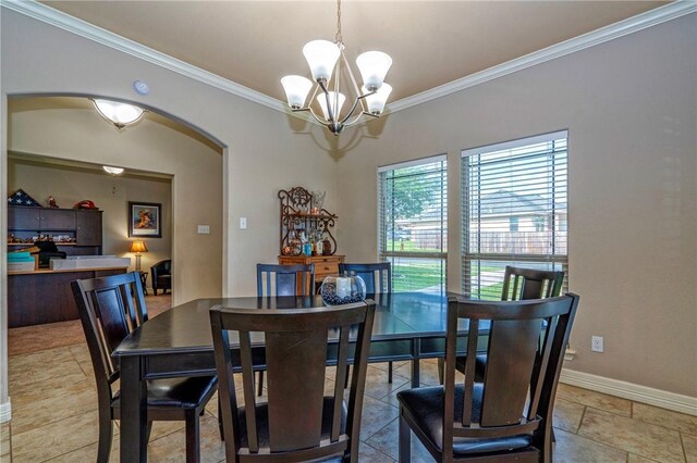 4522 Big Cyprus, Corpus Christi, TX 78410 - dining space featuring baseboards, ornamental molding, arched walkways, and a chandelier
