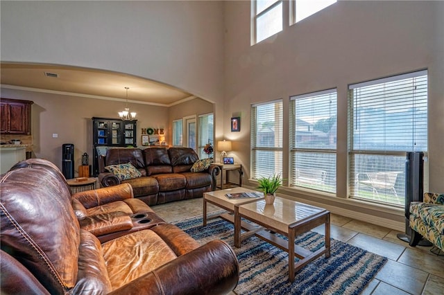 4522 Big Cyprus, Corpus Christi, TX 78410 - living area featuring visible vents, crown molding, arched walkways, a chandelier, and a high ceiling