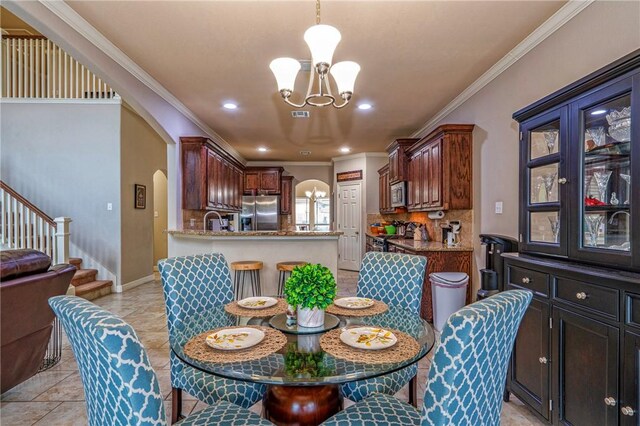 4522 Big Cyprus, Corpus Christi, TX 78410 - dining room with crown molding, arched walkways, stairway, a chandelier, and recessed lighting