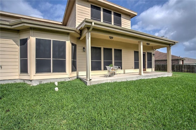 4522 Big Cyprus, Corpus Christi, TX 78410 - rear view of house featuring a patio, a lawn, and fence