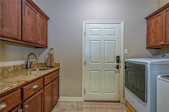 4522 Big Cyprus, Corpus Christi, TX 78410 - clothes washing area with cabinet space, independent washer and dryer, baseboards, and a sink