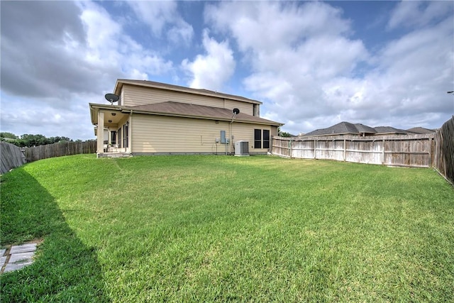 4522 Big Cyprus, Corpus Christi, TX 78410 - back of house with a yard, central AC unit, and a fenced backyard