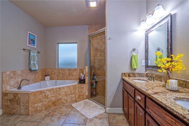 4522 Big Cyprus, Corpus Christi, TX 78410 - bathroom featuring a sink, double vanity, baseboards, a shower stall, and a bath