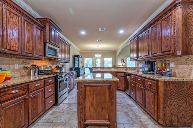 4522 Big Cyprus, Corpus Christi, TX 78410 - kitchen with a peninsula, tasteful backsplash, light stone countertops, and stainless steel appliances