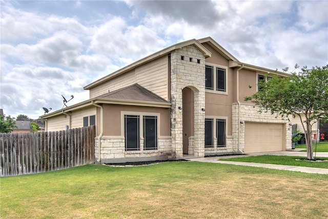 4522 Big Cyprus, Corpus Christi, TX 78410 - traditional-style home featuring a garage, a front lawn, fence, stone siding, and stucco siding