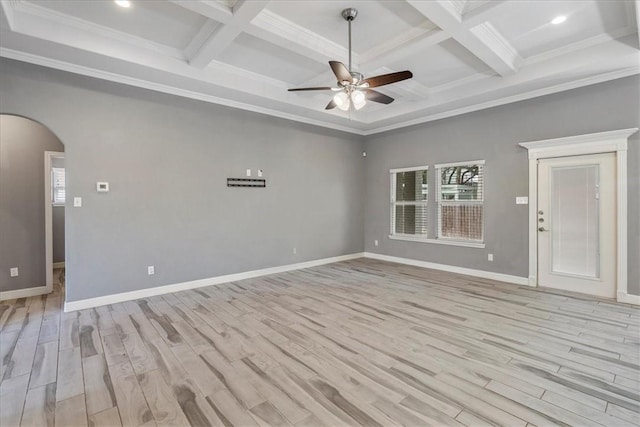 empty room with arched walkways, ceiling fan, light wood-style floors, beam ceiling, and baseboards