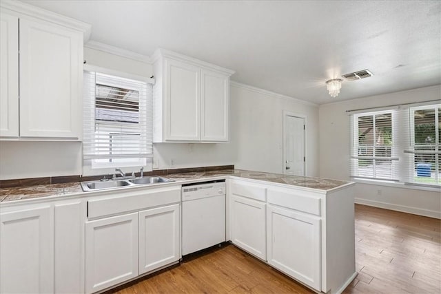 330 Ohio Ave, Corpus Christi, TX 78404 - kitchen with dishwasher, a peninsula, white cabinetry, crown molding, and light wood-style flooring