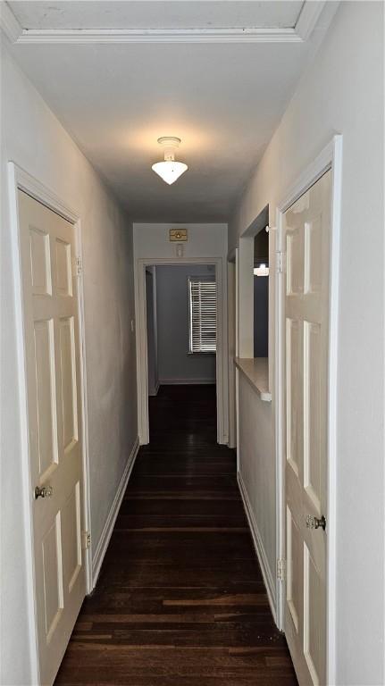 corridor with dark wood-type flooring