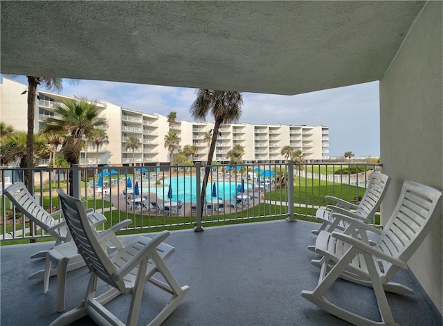 800 Sandcastle Dr Unit 129, Port Aransas, TX 78373 - balcony with view of pool area