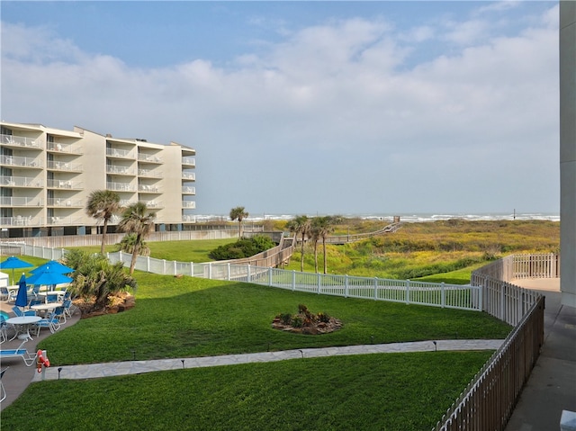 view of yard with a balcony