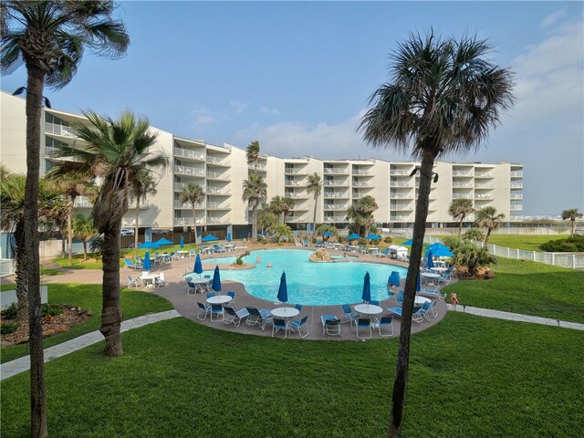 view of pool featuring a yard