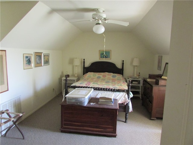 bedroom with light colored carpet, ceiling fan, and vaulted ceiling