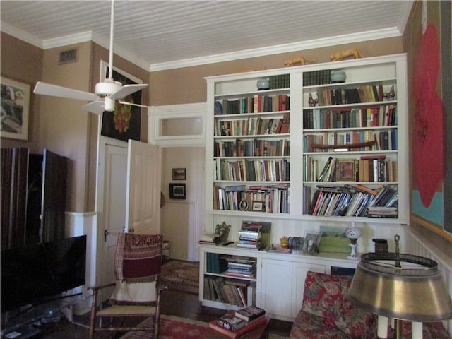 sitting room featuring ceiling fan and ornamental molding