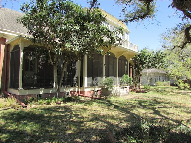 view of yard with a sunroom