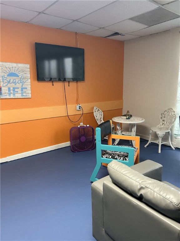 3938 Surfside Blvd Unit 1121, Corpus Christi, TX 78402 - rec room with a drop ceiling and finished concrete flooring