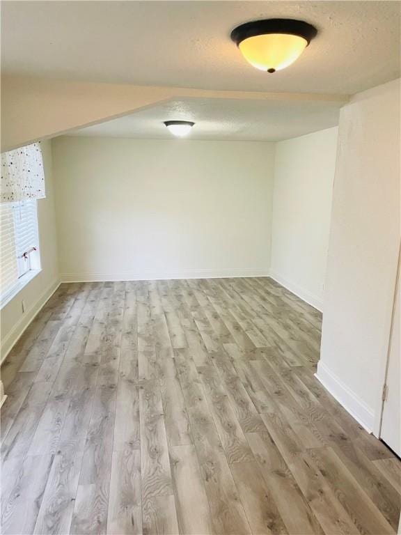 spare room featuring light wood-type flooring