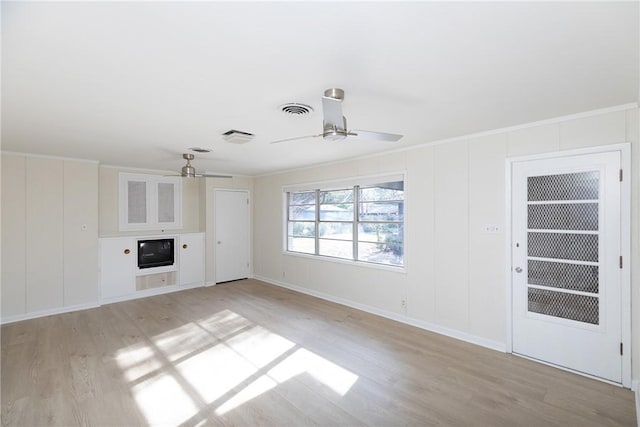 unfurnished living room with ceiling fan, light hardwood / wood-style flooring, and ornamental molding